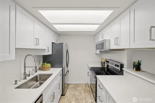 New cabinets, quartz countertop and stainless appliances