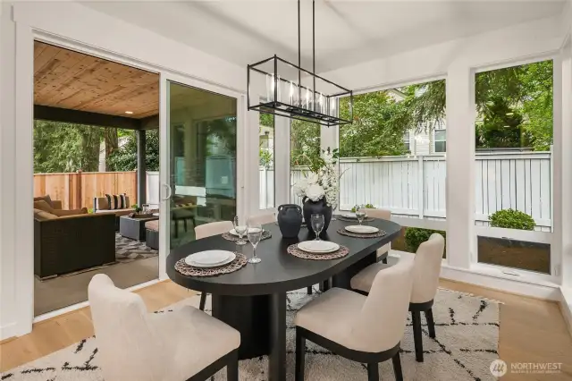 Nook opens to covered patio fireplace