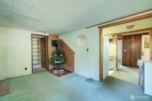 The living room features a wood-burning stove