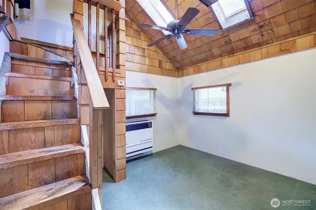 Vintage cedar shake accents this area of the house.  A propane unit heats the home.