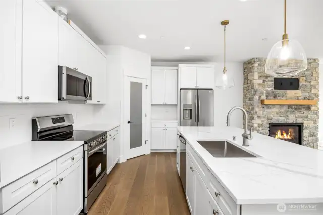 All white kitchen. Quartz countertops & Aristokraft white shaker-style cabinetry
