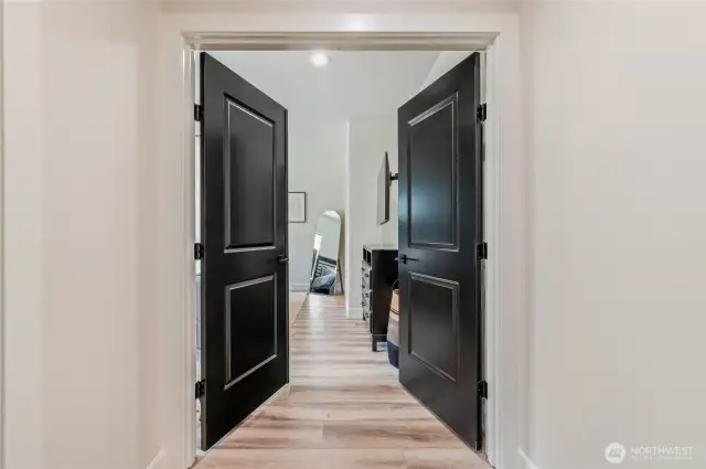 French Doors Lead to the Main Floor Primary Bedroom, Privately Tucked Away from Main Living Space