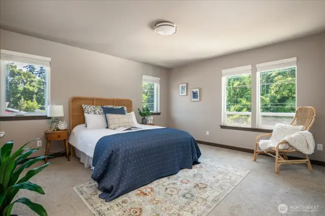 Huge primary bedroom can easily accommodate a king size bed.