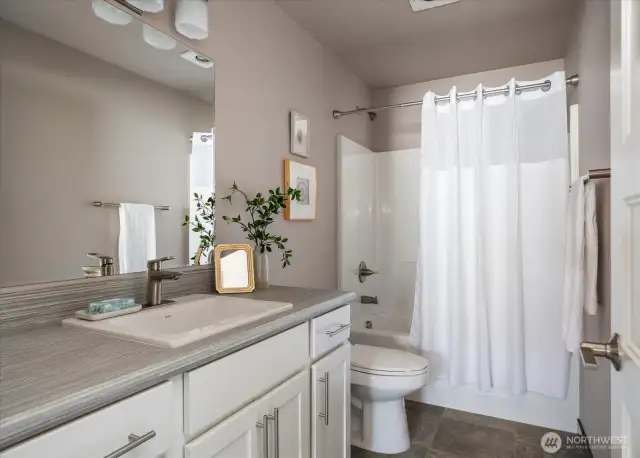 Full guest bathroom off the hallway.