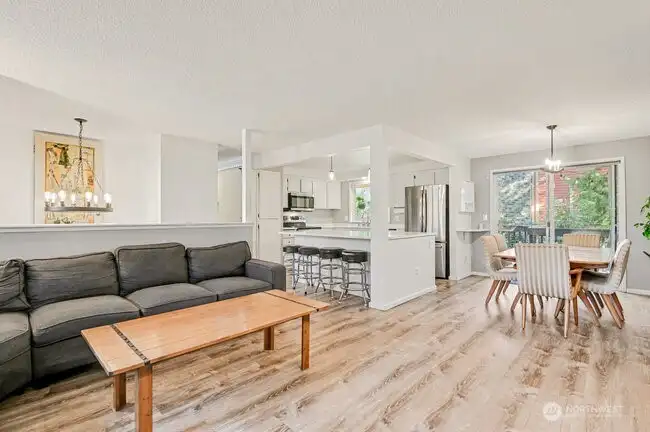 Kitchen open to both dining room and living room. With Eating Bar.