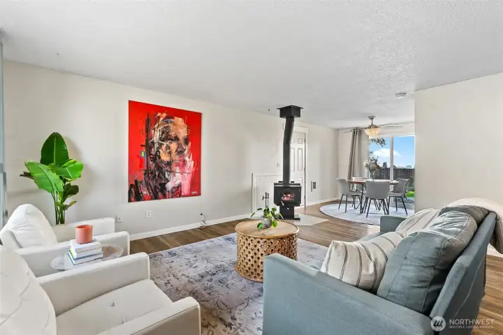 Lovely entry and main living area with cozy wood burning stove.