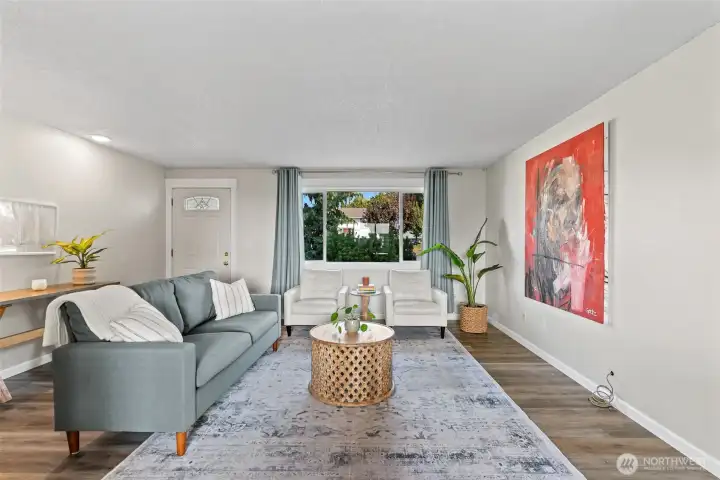 Gorgeous portrait window fills the home with natural light!