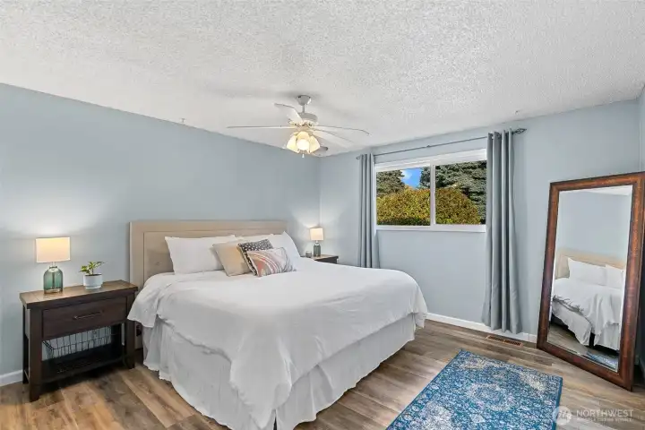 Spacious main bedroom located at the end of the hallway.