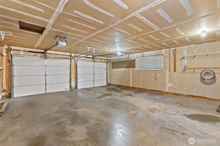 Spacious two-car garage with convenient man-door to the backyard.