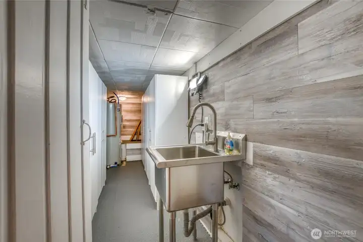 A long storage area is complete with cabinets and a wash tub when you come back from a long paddle.