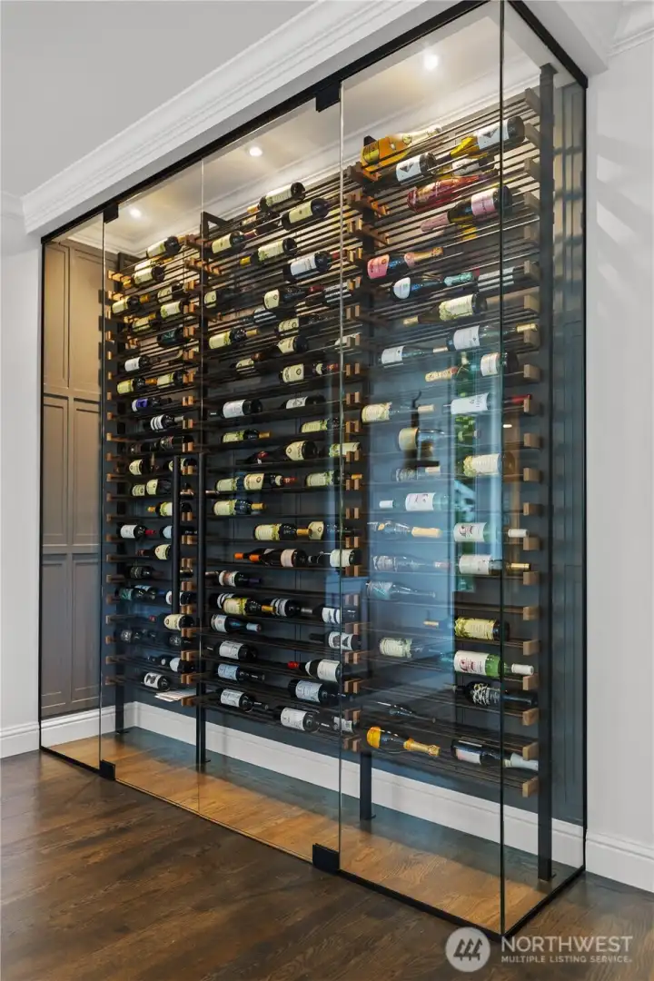Custom lit wine rack off of dining room is magical.