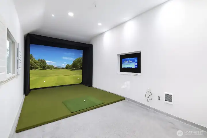 3rd bay is all wired and ready to go for golf simulator. Screen, mat and monitor have been digitally staged.