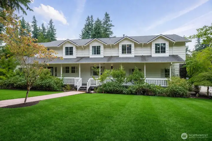 A timeless and inviting presence welcomes you to this beautifully maintained home, where classic architecture and serene surroundings create a true sense of retreat. The expansive yard offers exceptional space to relax, entertain, and enjoy the outdoors, framed by mature landscaping and a charming covered porch that enhances the home’s warm, approachable character.    The lawn has been enhanced to illustrate its seasonal potential. In spring and summer, with regular watering, the yard becomes a rich, green outdoor space ideal for relaxing and entertaining.
