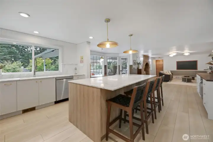 Just beyond the dining room, the all-new kitchen shines as the home’s centerpiece—anchored by a stunning marble island and designed for effortless flow into the living spaces. Sophisticated yet inviting, it’s a space made for gathering.