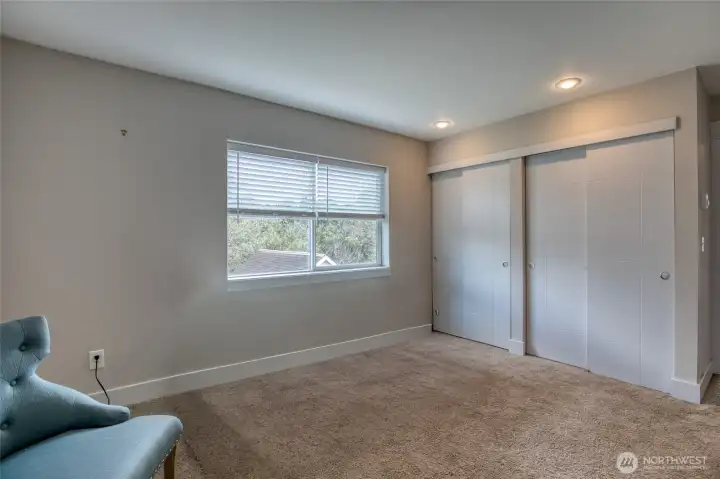 Large guest bedroom has nice views.