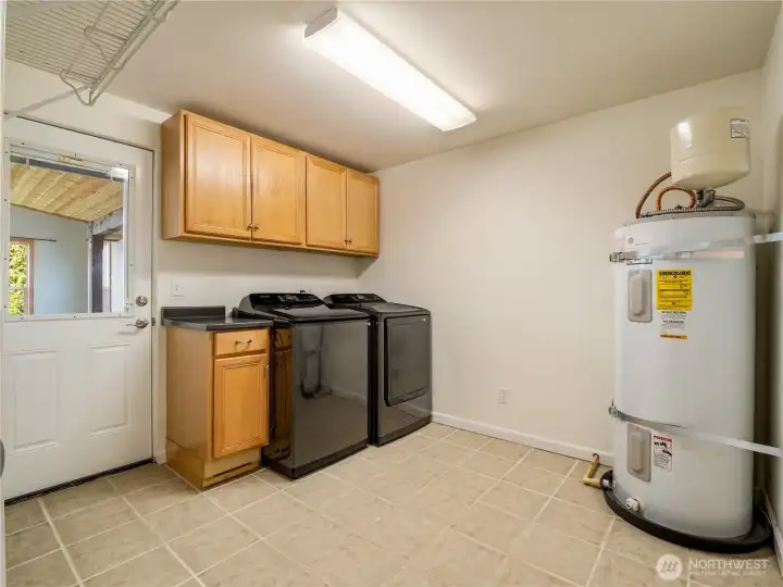 Over sized utility room has great potential or extra storage.