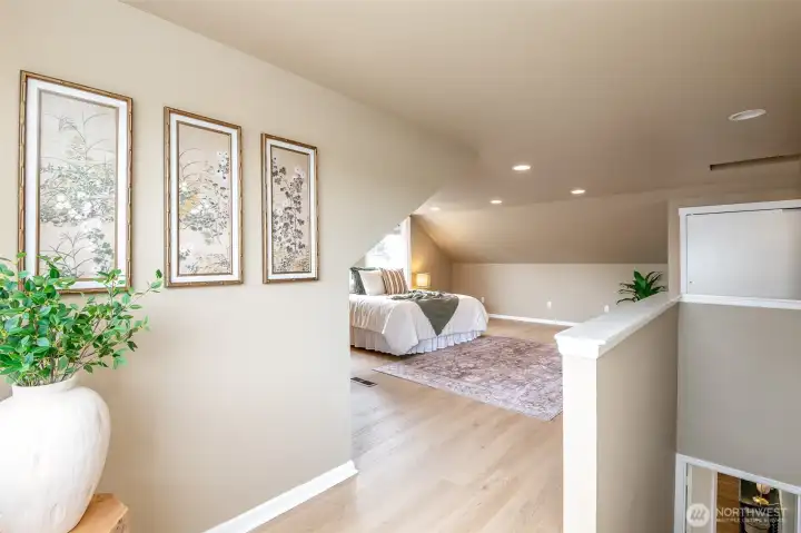This spacious primary suite includes a 3/4 bathroom and an office.