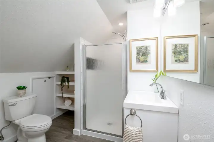 Newer shower in primary bathroom adds convenience and value.