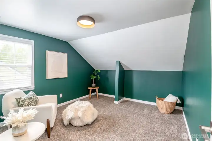 This charming flexible room is perfect for an office, reading nook, or creative space.