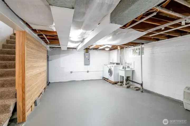 This huge unfinished space is ideal for storage, a rec room, home gym, or workshop. Or with the great ceiling height, this portion of the basement could easily get finished.