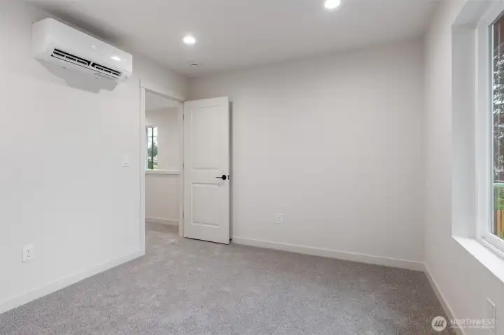 One of four spacious bedrooms.