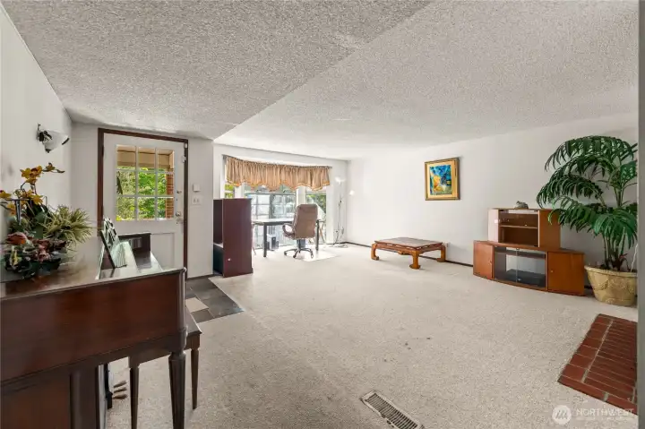 front room with large open windows to the front yard front room with large open windows to the front yard