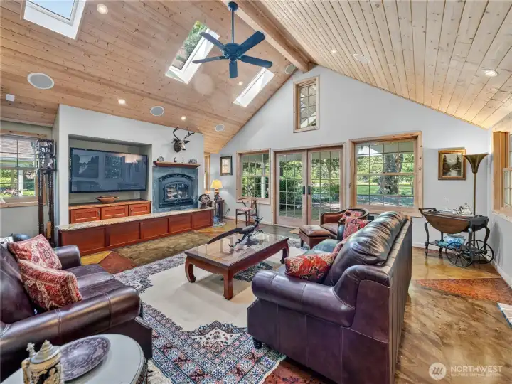 Amazing entertaining space with wood fireplace insert.