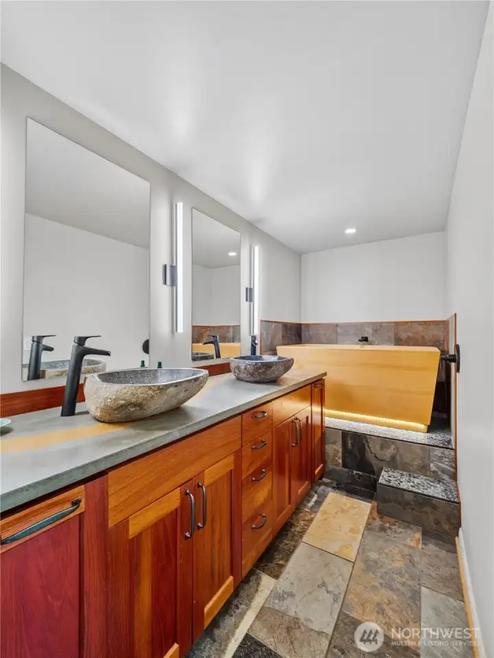 Dual sink vanity and Hinori Cypress soaking tub.