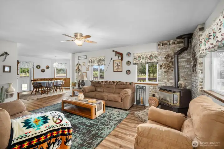 Living room with expansive windows, creating a bright and welcoming space perfect for entertaining. Living room with expansive windows, creating a bright and welcoming space perfect for entertaining.