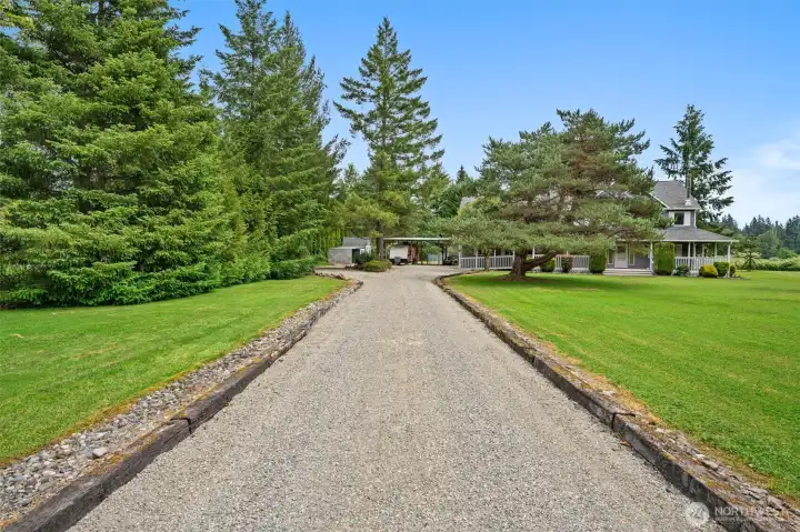 Follow the long driveway home to a peaceful retreat surrounded by beautifully maintained grounds. Follow the long driveway home to a peaceful retreat surrounded by beautifully maintained grounds.