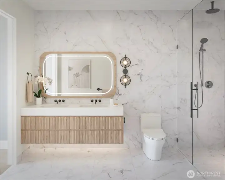 Primary bathroom in the Earth Palette with soft-close fluted wood veneer cabinets with interior outlet and undercabinet lighting, dual undermount sinks with polished quartz vanity top, Illuminated vanity mirror with custom wall sconce, heated tile flooring, curbless glass enclosed shower with tiled niche and striking dark chrome wall mounted Dornbracht fixtures.
