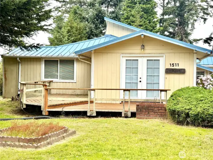 Deck and double doors on the front of the home Deck and double doors on the front of the home