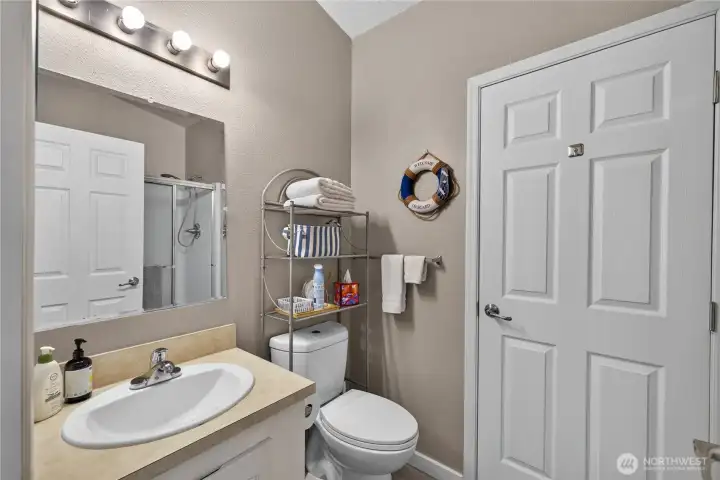 Guest bath with door to utility / mudroom. Guest bath with door to utility / mudroom.