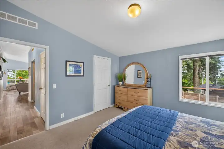 Hallway leads to primary suite. Hallway leads to primary suite.