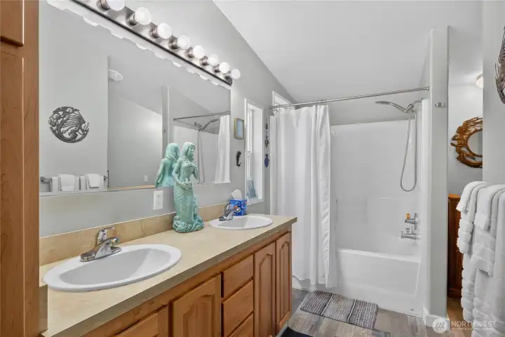 Ensuite bath with walk-in closet and tub/shower. Ensuite bath with walk-in closet and tub/shower.