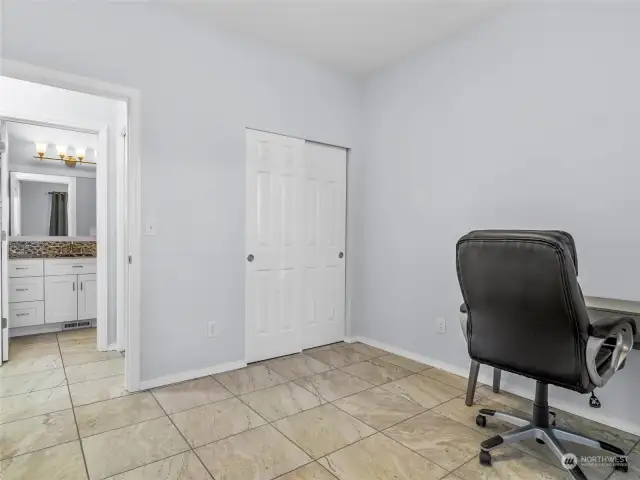 Another angle of bedroom number three shows the closet and bath, located conveniently across the hall