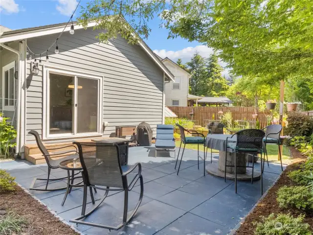 You thought the inside was great?!  Just wait until you see this yard!  Newly stained paver patio outside the family room is the perfect landing spot for summer parties and BBQ's, or evening reading by the peaceful water feature