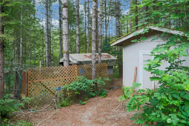 Storage shed with outside water spigot.