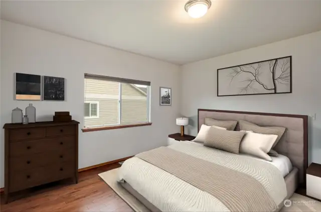 Large private primary bedroom with an en-suite bathroom! Walk-in closet, wood floors and a private door to the backyard covered deck. Virtually staged.