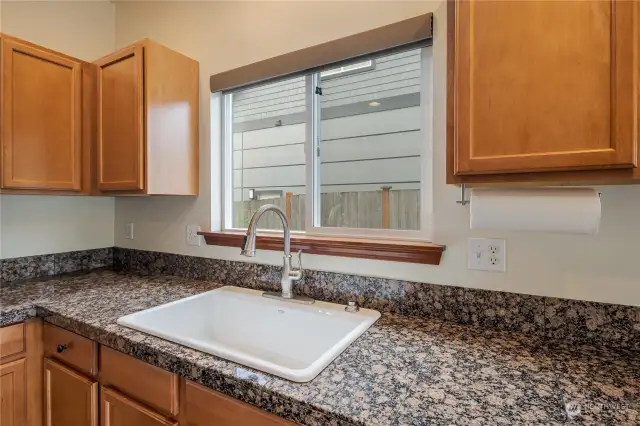 Nice and bright kitchen sink with private territorial views to the side backyard.