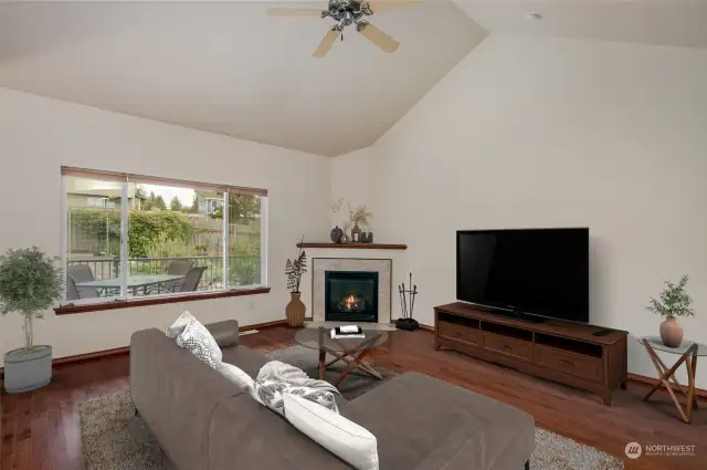 Extra large great room with EZ gas fireplace. Hardwood floors and high ceilings!  Virtually staged.