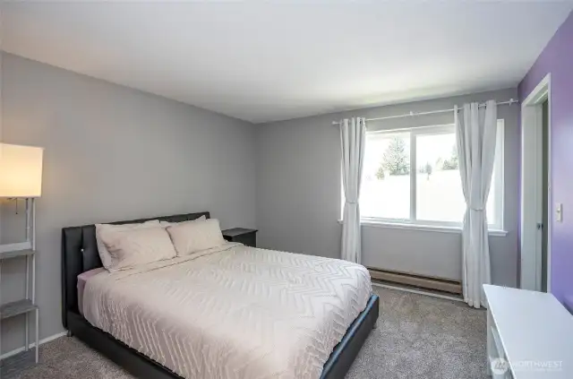 Additional view of the primary suite, highlighting its inviting atmosphere and layout.