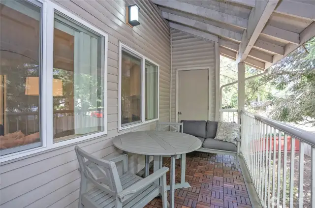 Private deck with a spacious storage closet, offering peaceful views in a secluded setting.