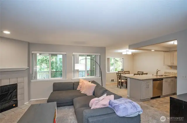 Spacious open layout with clear sightlines between the living, kitchen, and dining areas—creating a bright and connected living space.