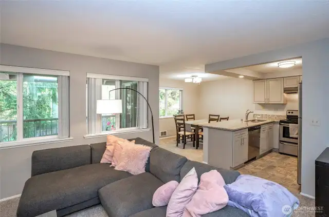 Just beyond the large picture windows, you'll find a private deck—perfect for relaxing or entertaining.