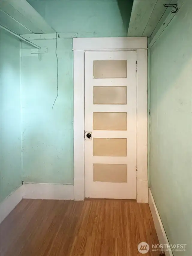 Spacious walk-in closet with bathroom entry