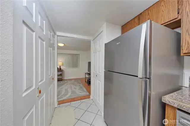 Nice sized pantry just beyond the new refrigerator