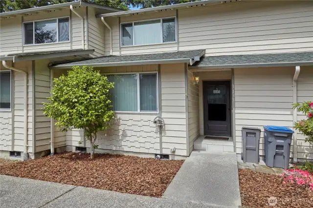 Townhome front entry with planter areas to grow your own flowers