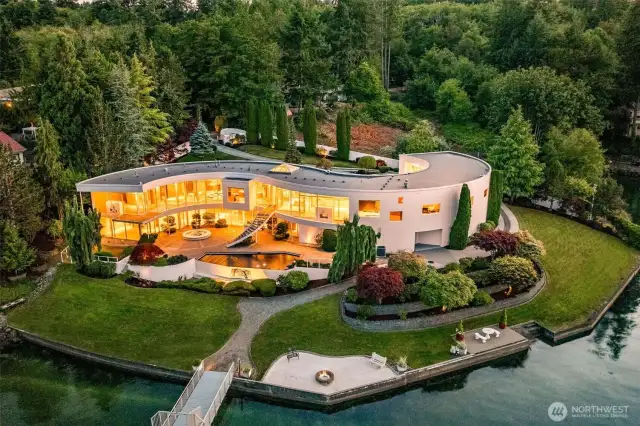 An Icon Revealed – The S House on Wollochet Bay. This architectural tour de force curves along 335’ of private waterfront, showcasing its signature S-shaped design, two stories of glass, and rare deepwater dock. A one-of-a-kind Gig Harbor estate where light, water, and luxury converge