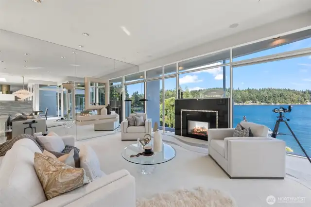 From sunrise sparkles to golden sunsets over the deepwater dock, this space is the heart of the home’s architectural magic